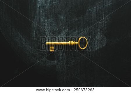 Education Is The Key To Success, Vintage Golden Latchkey On Blackboard Surface As Copy Space