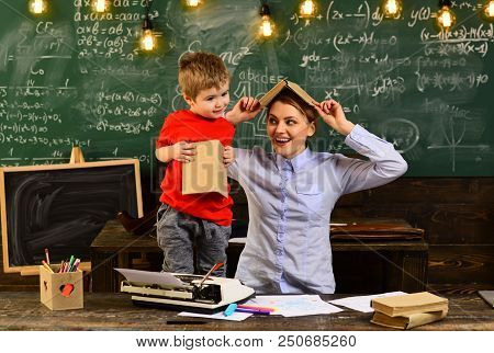 People Learning Education And School Concept, Tutor Asks The Tutee To Find The Definition In The Tex