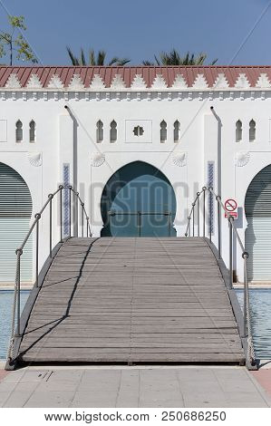 Foreground Vertical View Of Wooden Bridge In The Back Facade Of The Moruno Building In The City Of C