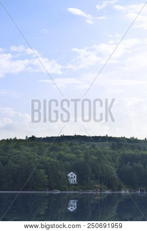 A Home Nestled In The Woods By Lake Sunapee In New Hampshire, U.s.a.