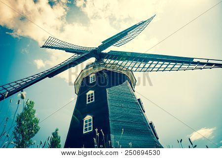 Wheat Windmill. Harvest Concent. The Stock Photo.
