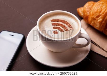 Cup Of Coffee With Wifi Sign On The Foam. Free Access Point To The Internet Wifi. I Like Coffee Brea