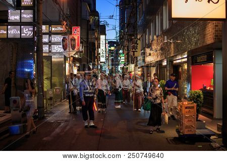 Osaka, Japan - July 23, 2018: Parade Participants Gather In Narrow Kitashinchi Street On The Eve Of