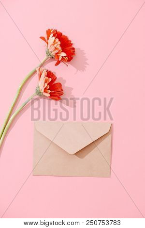 Blank Greeting Card With Brown Envelope And Gerbera Flower On Pink Table With Vintage And Vignette T