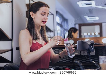 Good-looking Blogger. Good-looking Appealing Beauty Blogger Taking Her Makeup Off After Long Day
