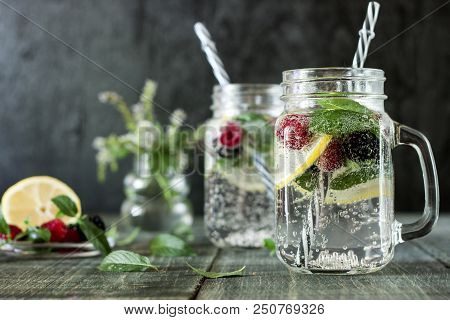 A Cooling Lemon Drink In A Glass Cup On A Wooden Table