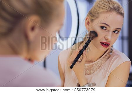Red Lips. Appealing Good-looking Stylish Woman With Red Lips Holding Face Brush In Her Hand