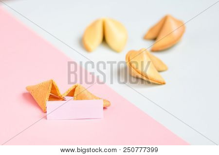 Fortune Cookie On Pink And Blue Background, Pastel Colors, Copy Space For Prediction