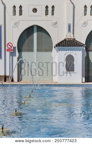 Vertical View Of Pond And Back Facade Of Moruno Building In The City Of Castellon, Spain