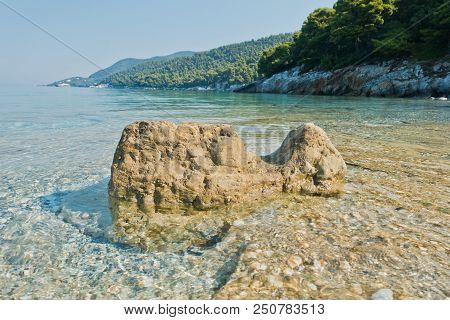 Sea Rocks At Calm And Crystal Clear Turquoise Water At Morning, Milia Beach, Island Of Skopelos, Gre