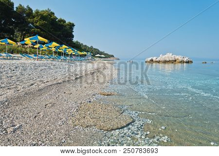 Sea Rocks At Calm And Crystal Clear Turquoise Water At Morning, Milia Beach, Island Of Skopelos, Gre
