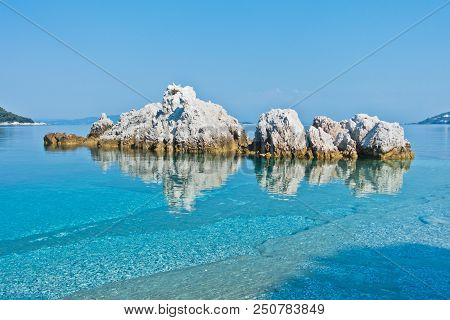 Sea Rocks At Calm And Crystal Clear Turquoise Water At Morning, Milia Beach, Island Of Skopelos, Gre