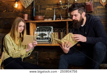 Soulful Evening Concept. Girl And Man On Calm Faces Reading Book In Warm Atmosphere. Father Instills