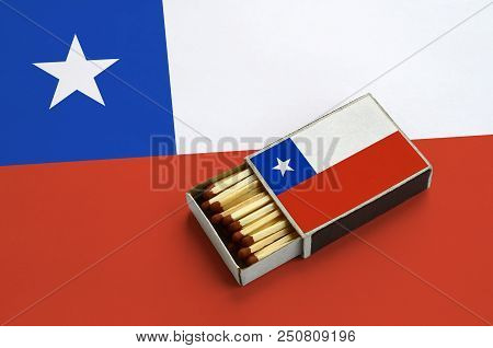 Chile Flag  Is Shown In An Open Matchbox, Which Is Filled With Matches And Lies On A Large Flag.