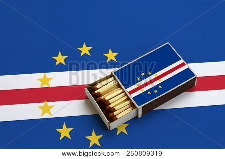 Cabo Verde Flag  Is Shown In An Open Matchbox, Which Is Filled With Matches And Lies On A Large Flag
