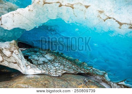 Blue Ice Cave Of Svartisen Glacier In Norway