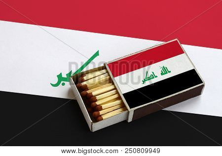 Iraq Flag  Is Shown In An Open Matchbox, Which Is Filled With Matches And Lies On A Large Flag.