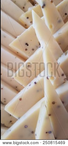 White Cheese With Spices And Sliced Bits Close-up.