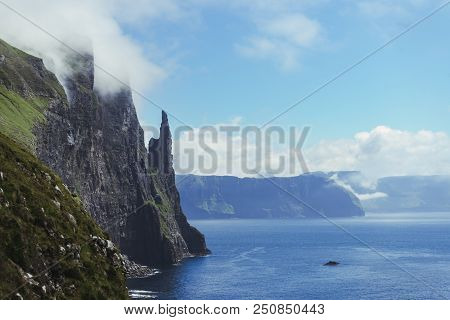 Beautiful View Of Trollkonufingur (witch's Finger) Fjord Appear From Clouds In Blue Sky Next To Nort