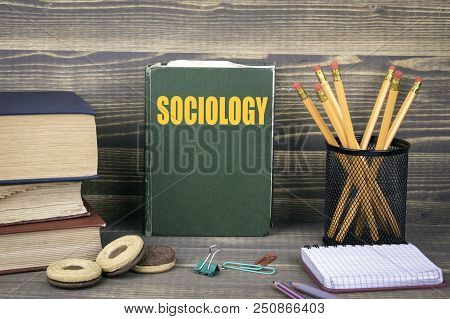 Sociology Business Concept. Book On A Wooden Background.