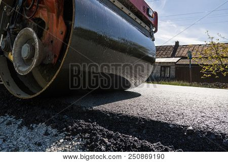 Heavy Vibration Roller At Asphalt Pavement Working On The New Road Construction Site. Repairing