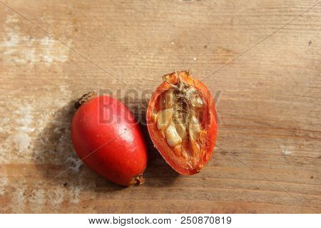 Rosehip Berries On Wooden Background. Autumn Composition. Useful Tea Ingrid.
