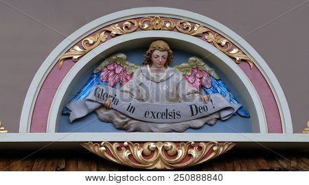 STITAR, CROATIA - NOVEMBER 30: Angel with Gloria in excelsis Deo Banner, Nativity Scene, altarpiece in the church of Saint Matthew in Stitar, Croatia on November 30, 2017.