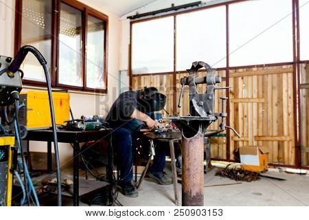 Industrial Vise Tool In Workshop For Support Hard Work. Tool For Metalworking, Fixing And Squeezing
