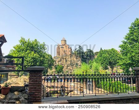 Tbilisi, Georgia - July 10, 2018: View Of The Old Metekhi Temple, Georgian Orthodox Cathedral In Tbi