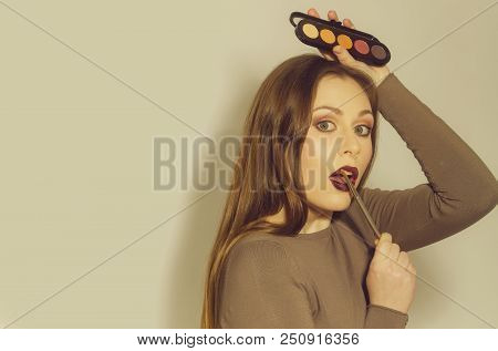 Woman Or Fashionable Model With Long Hair And Young Skin Applying Makeup On Pretty Face With Brush A