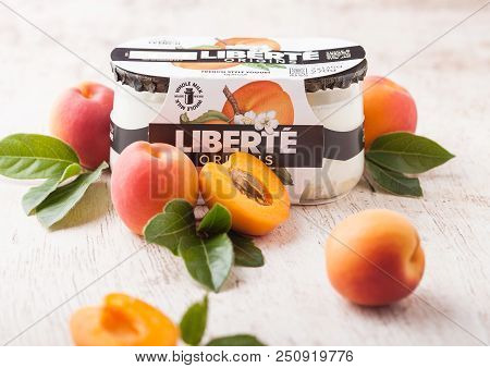 London, Uk - July 28, 2018: Pack Of Liberte Origins French Style Yogurt With Apricot Flavour On Wood