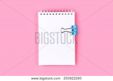 Top View Of Blank Notebook With Peb On Colorful Background Pink With Copy Space.