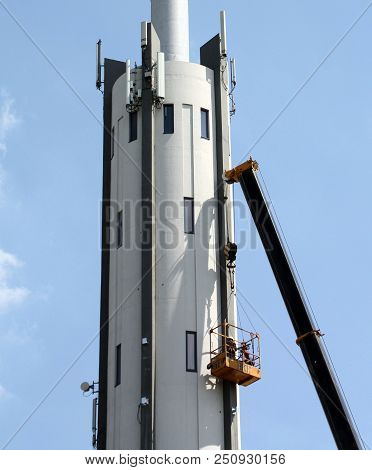 Groningen. July-24-2018. Working On The Antenna Tower Of The Former Kpn Building In The City Of Gron