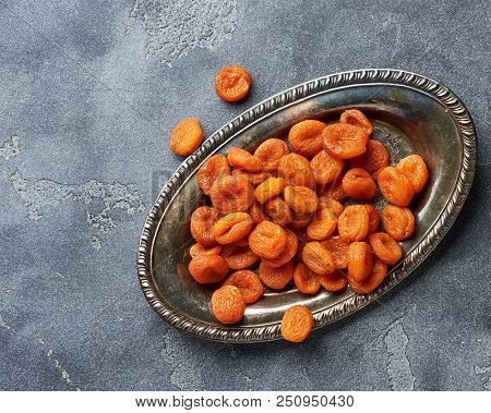 Dried Apricots On Gray Background. Witn Copy Space. Top View.