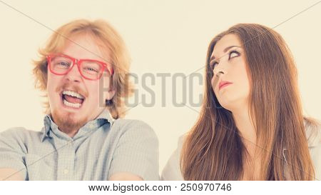 Woman Being Irritated Looking Displeased At Her Friend Or Boyfriend Being Silly, Fooling Around And 