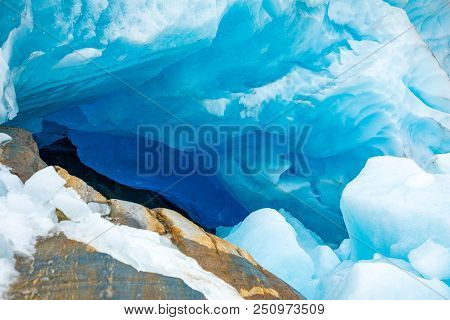 Blue Ice Cave Of Svartisen Glacier In Norway