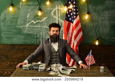 Politician: Sit With Stack Of Us Currency