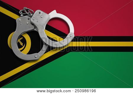 Vanuatu Flag  And Police Handcuffs. The Concept Of Crime And Offenses In The Country.