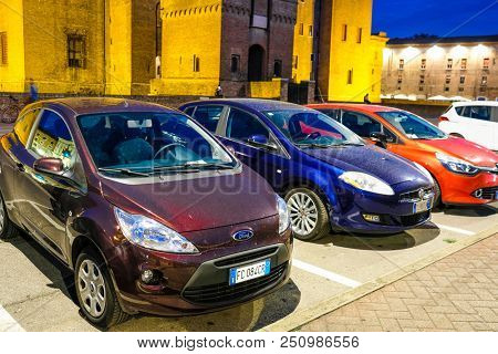 Ferrara, Italy - July, 23, 2018: cars parked in Ferrara, Italy, at night