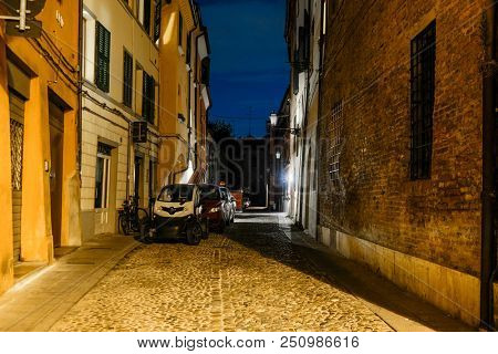 Ferrara, Italy - July, 23, 2018: cars parked in Ferrara, Italy, at night