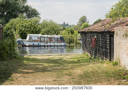 A Boat Moored Up On The River Waveney At Beccles, Suffolk, Uk