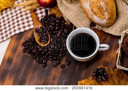 Cup Of Hot Coffee With Toast For Autumn Season Warm Drink. Fall Harvest Cornucopia. Copy Space On Wo