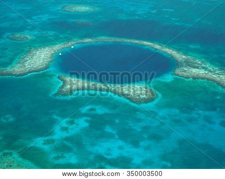 The Great Blue Hole, Belize, From The Air. Lighthouse Reef And Caye / Cay Off Belize Coast. Underwat