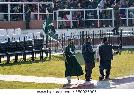 Wagah, Pakistan - Febuary 8, 2020: Pakistani Men Take A Selfie With A Performer Before The Wagah Bor
