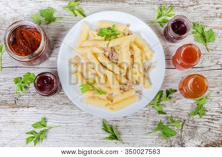 Boiled Penne Pasta Mixed With Stuffing Of Stewed Minced Pork And Fried Onion In Navy-style On White 