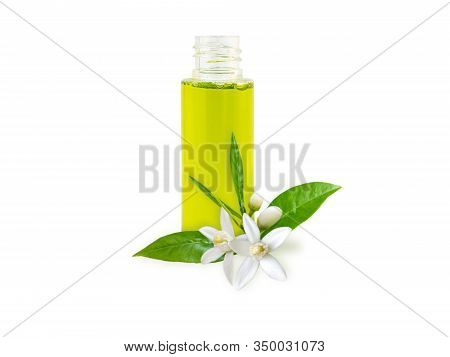 Neroli Essential Oil In The Bottle And Orange Tree Fragrant Flowers, Leaves And Buds Isolated On Whi