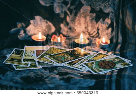 Tarot Card With Candlelight On The Darkness Background For Astrology Occult Magic Illustration / Mag