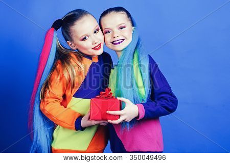 Sisters Wear Similar Outfits Have Same Hairstyle Kanekalon Braids Blue Background. Birthday Gift Con
