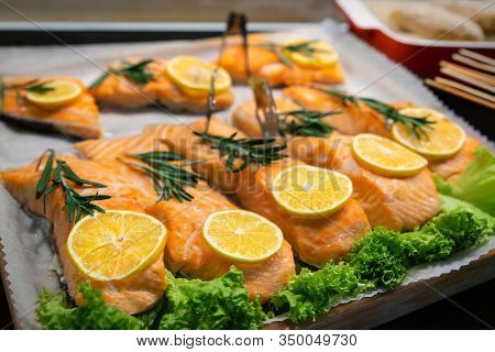 Cafe Fast Food Display Counter With Tray Of Baked Grilled Tasty Healthy Red Salmon Fishfillet Covere