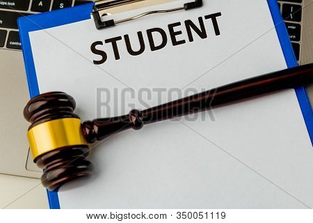 Fafsa. Student Aid Concept. Application Form Of Document On The Table With Wooden Hammer Isolated.